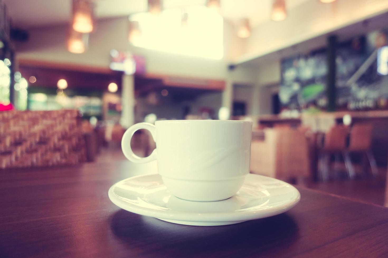 White coffee cup in coffee shop cafe photo