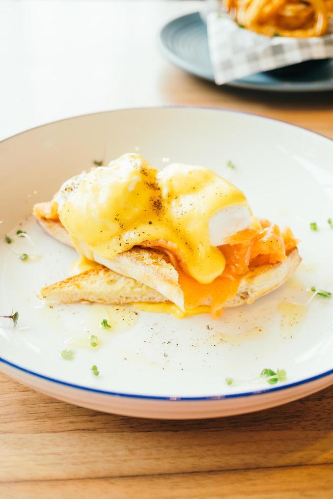 Eggs benedict with smoked salmon for breakfast photo