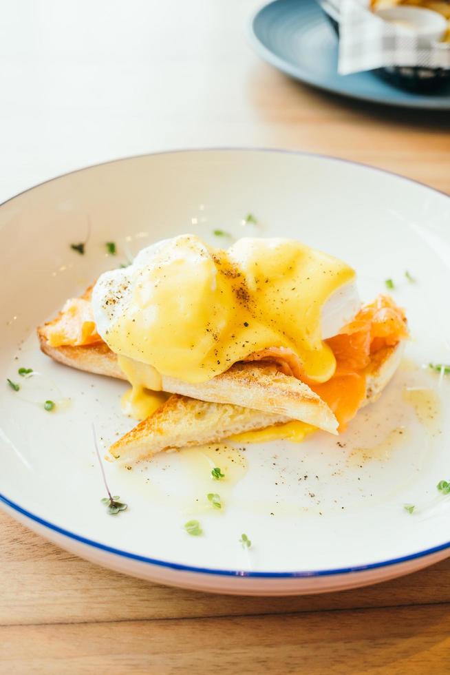 Eggs benedict with smoked salmon for breakfast photo