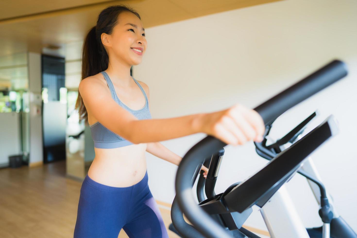 Portrait asian woman exercising and work out in gym photo