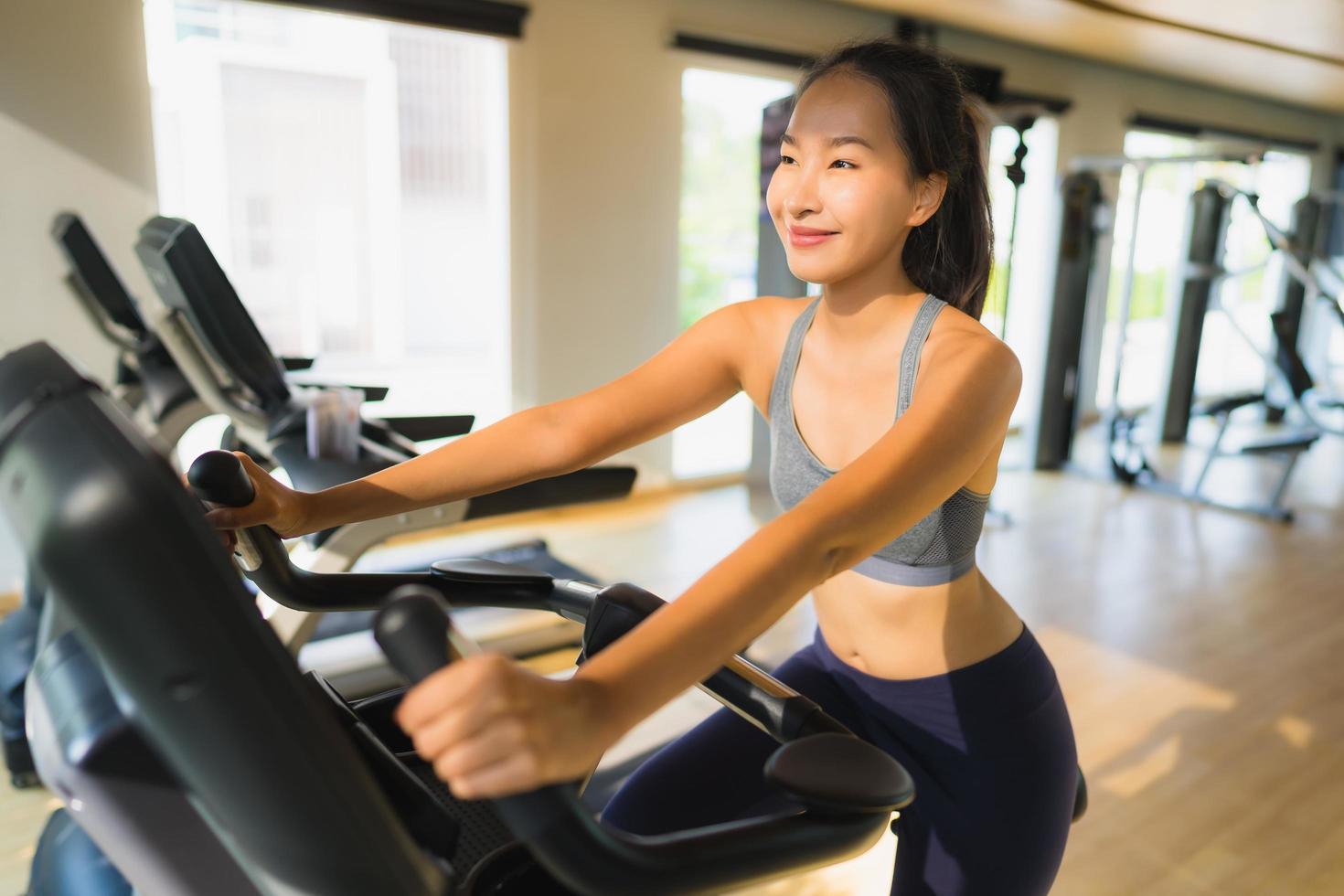Portrait asian woman exercising and work out in gym photo