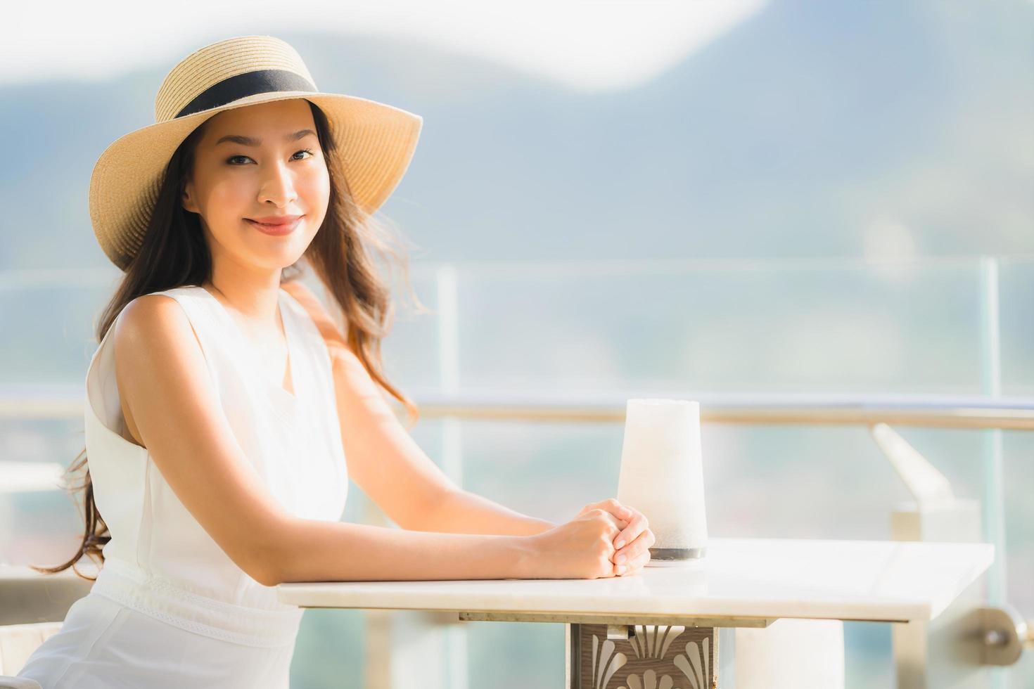 Portrait beautiful young asian woman smile happy in the sky bar and restaurant photo