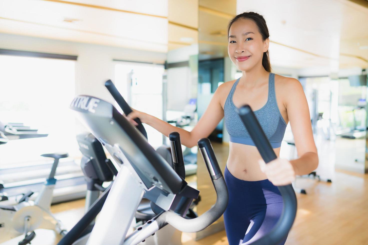 Portrait asian woman exercising and work out in gym photo