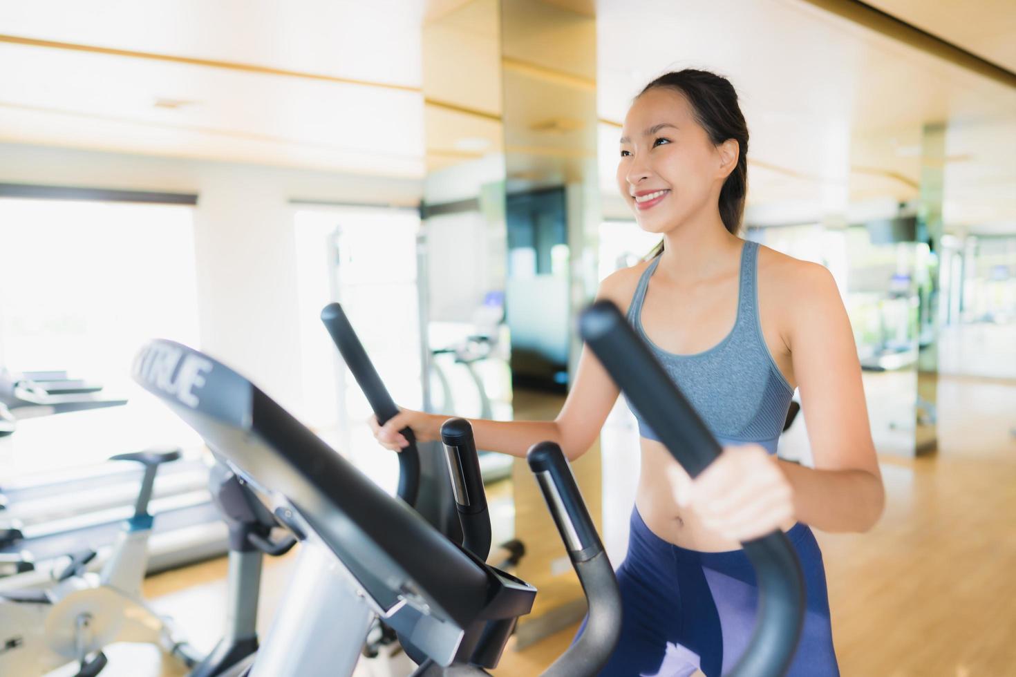 Portrait asian woman exercising and work out in gym photo