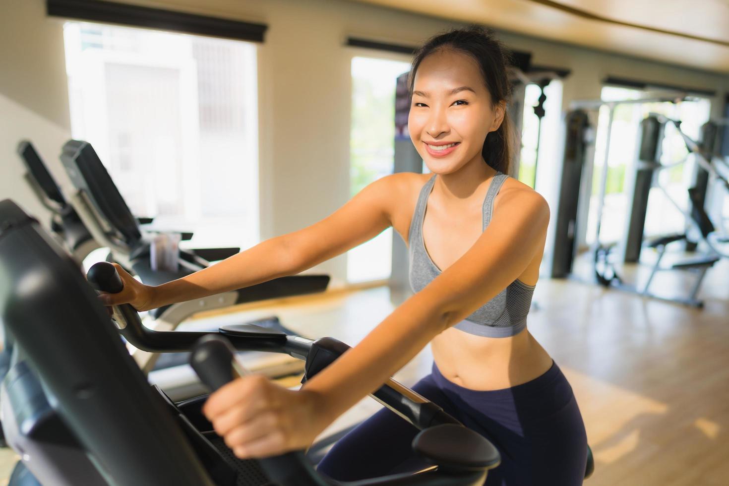 Portrait asian woman exercising and work out in gym photo