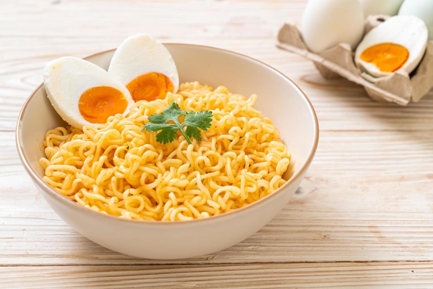 Instant noodles bowl with salt egg photo