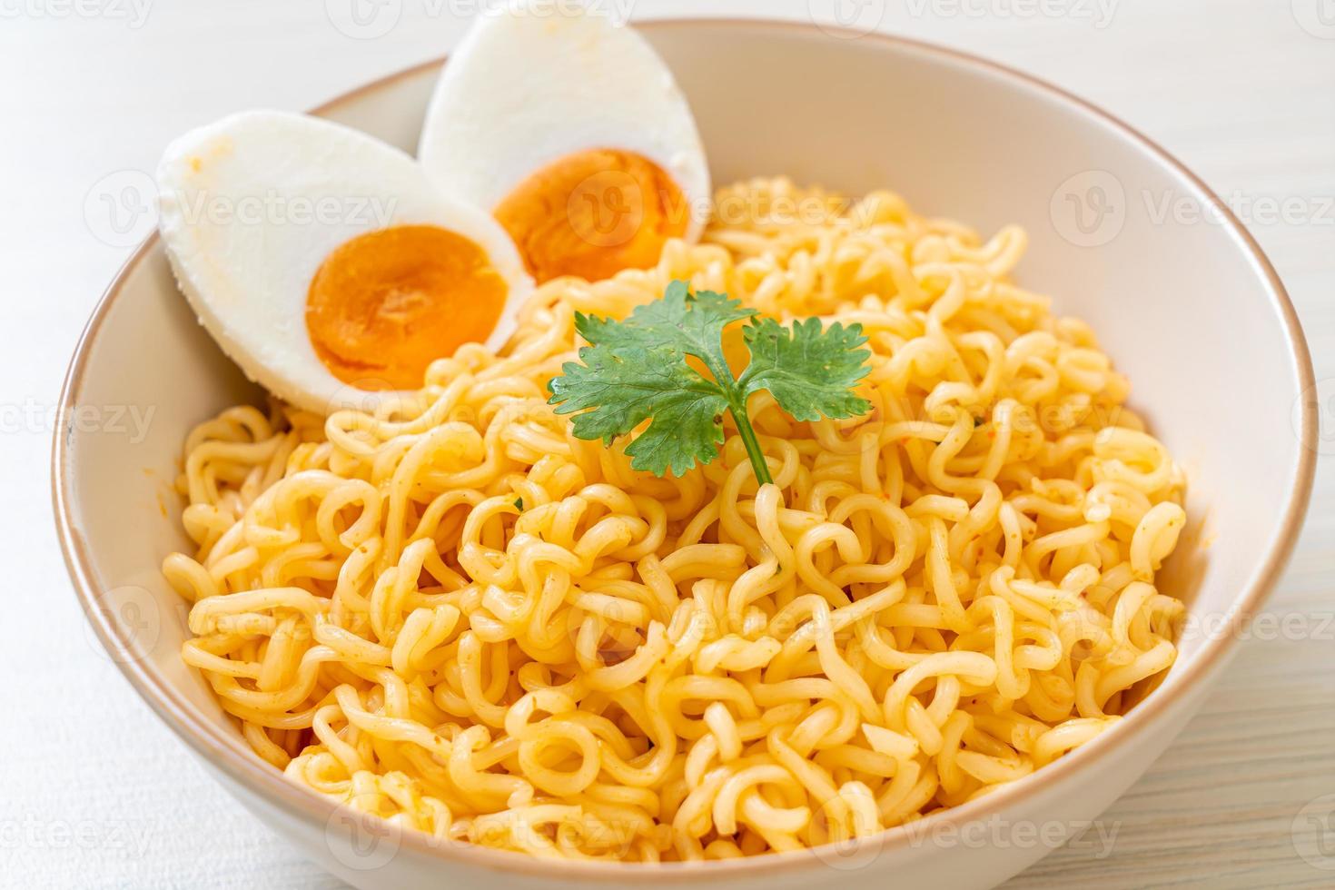 Instant noodles bowl with salt egg photo