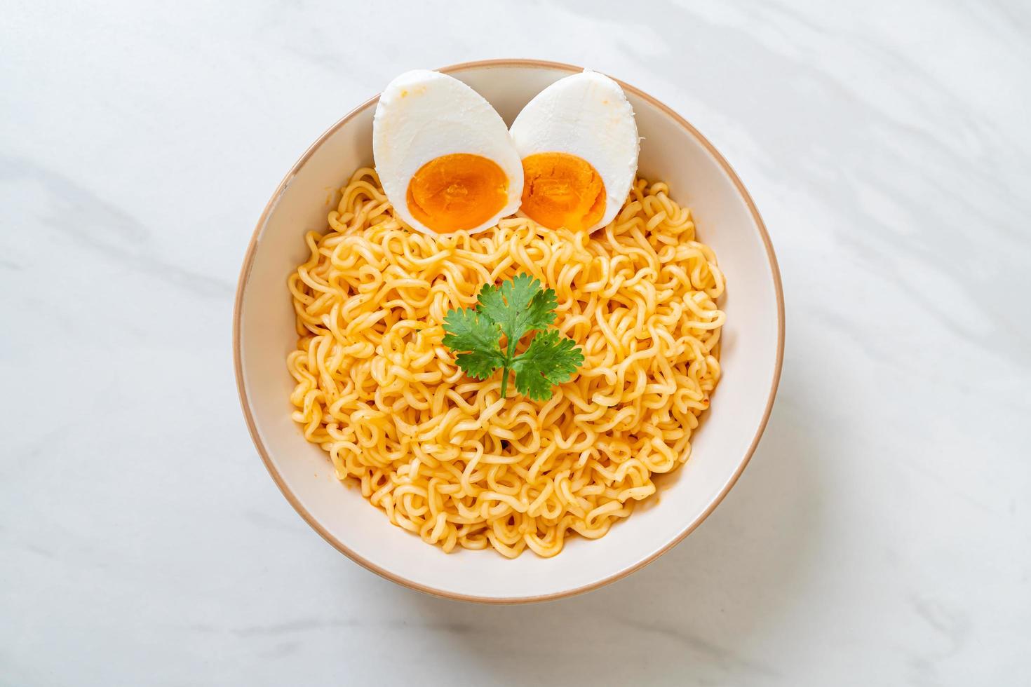 Instant noodles bowl with salt egg photo