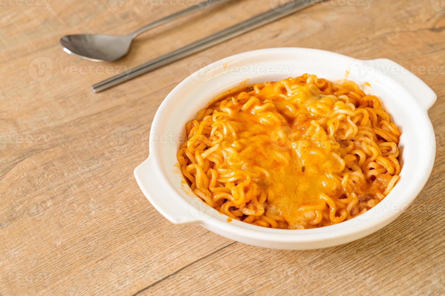 Spicy instant noodle bowl with mozzarella cheese photo