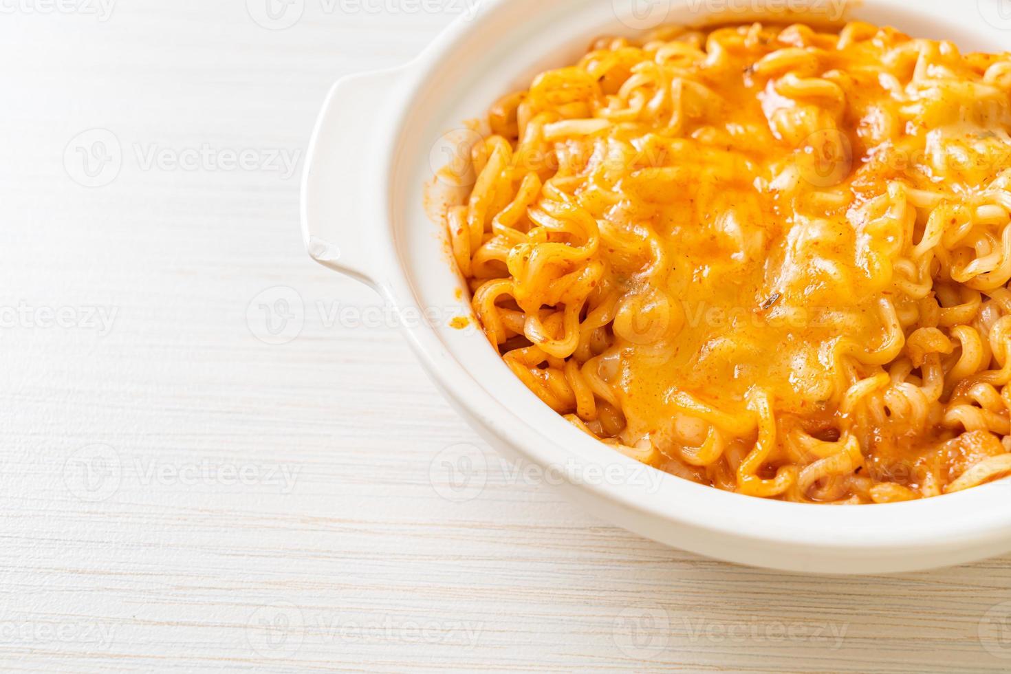 Spicy instant noodle bowl with mozzarella cheese photo