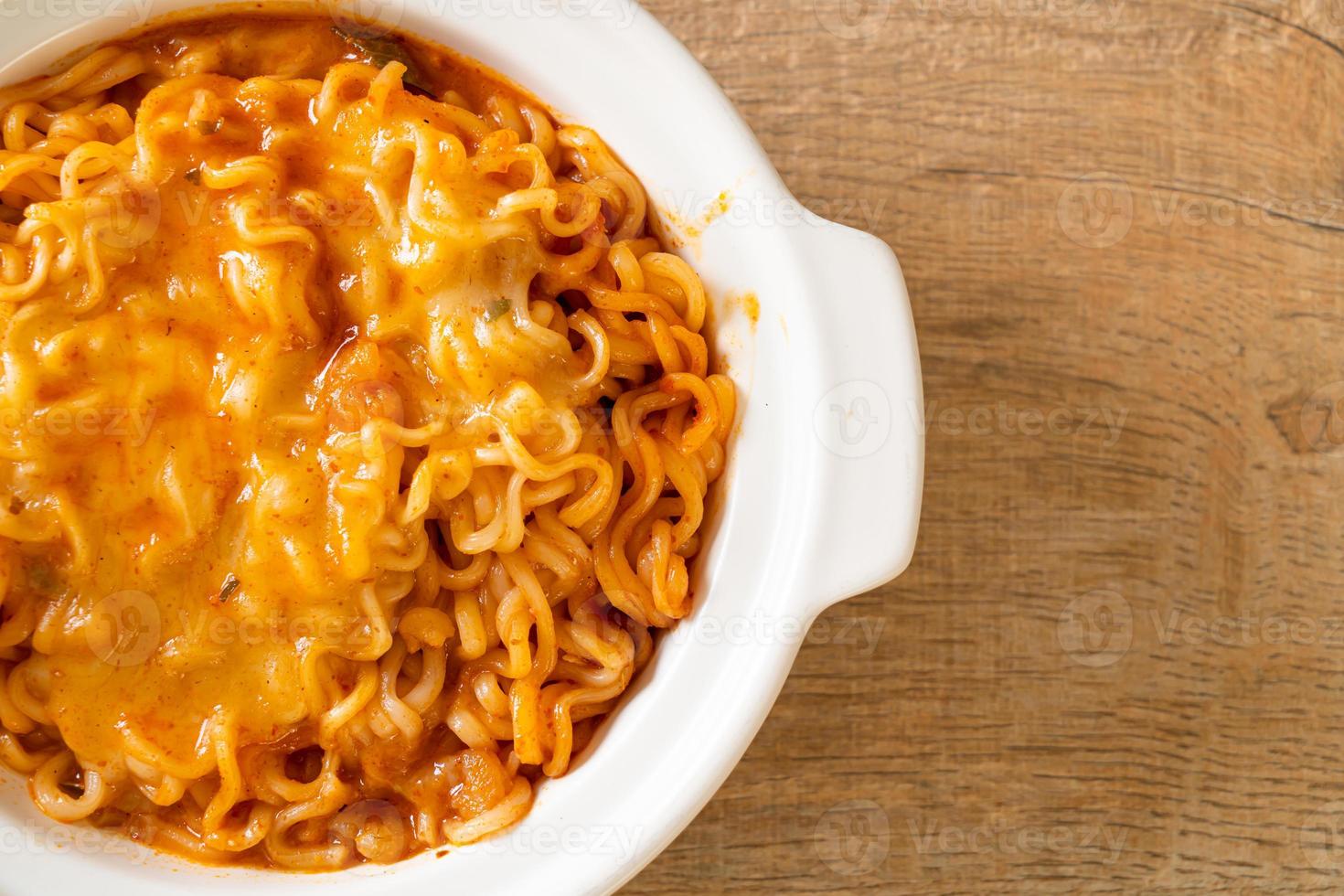 Spicy instant noodle bowl with mozzarella cheese photo