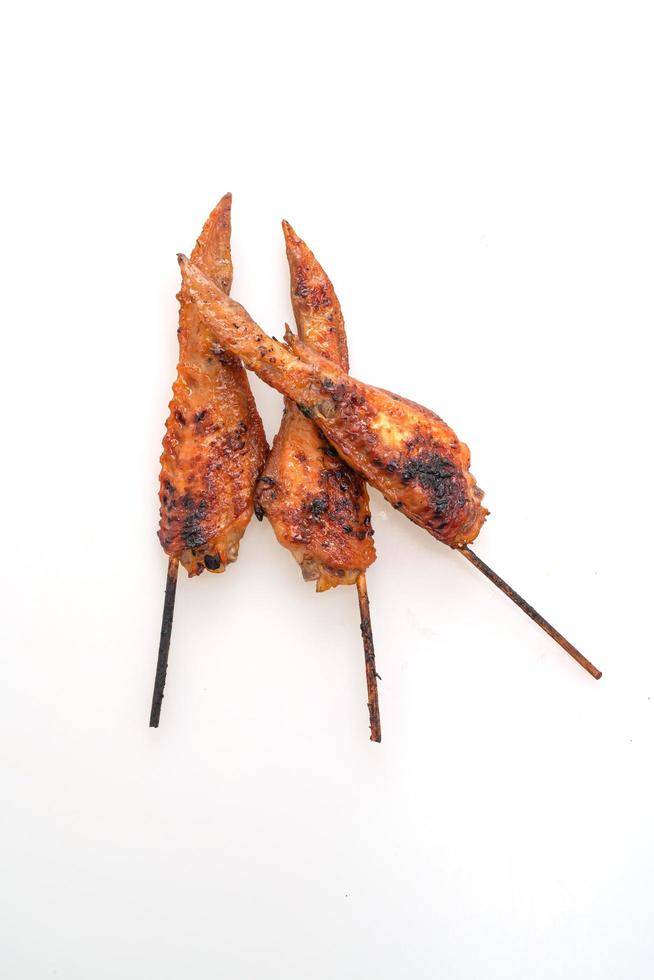 Grilled or barbecue chicken wings skewer with sticky rice photo