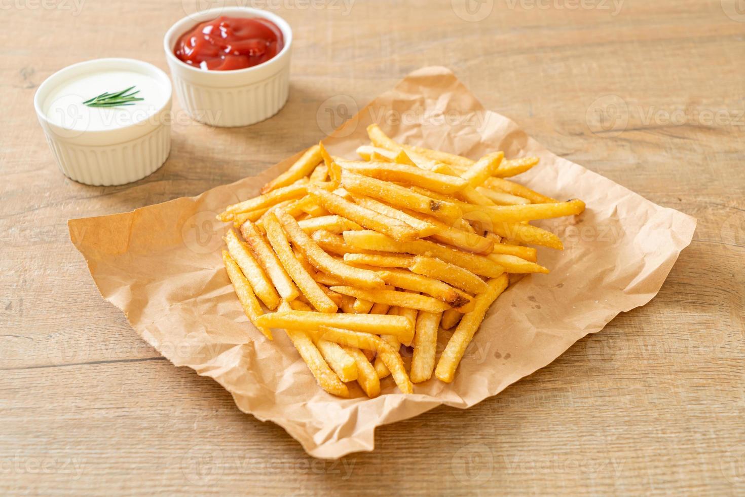 French fries with sour cream and ketchup photo