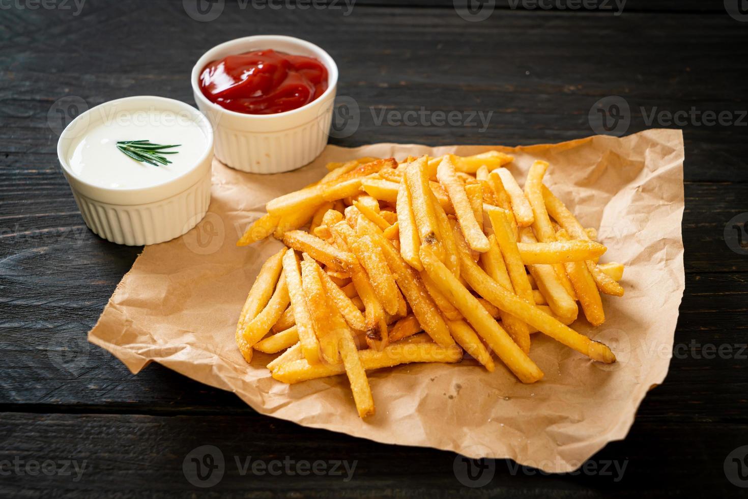 French fries with sour cream and ketchup photo