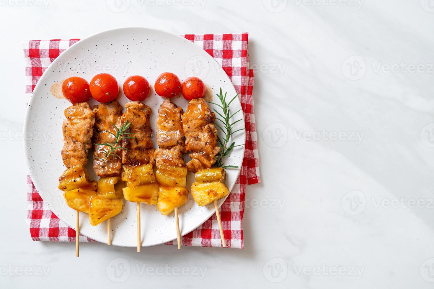 Grilled pork barbecue skewer on plate photo