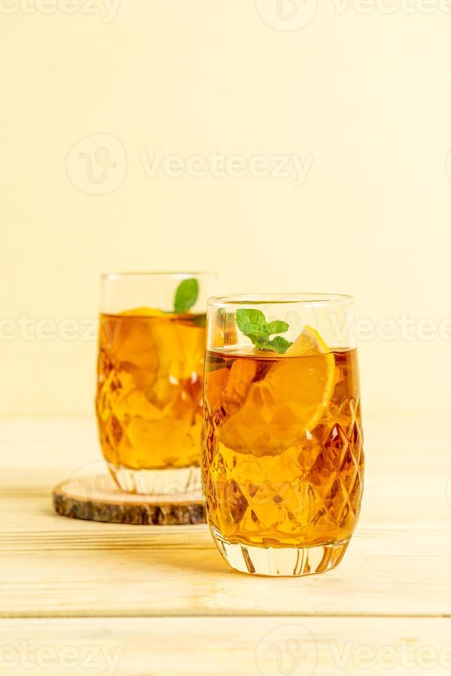 Glass of ice lemon tea with mint photo