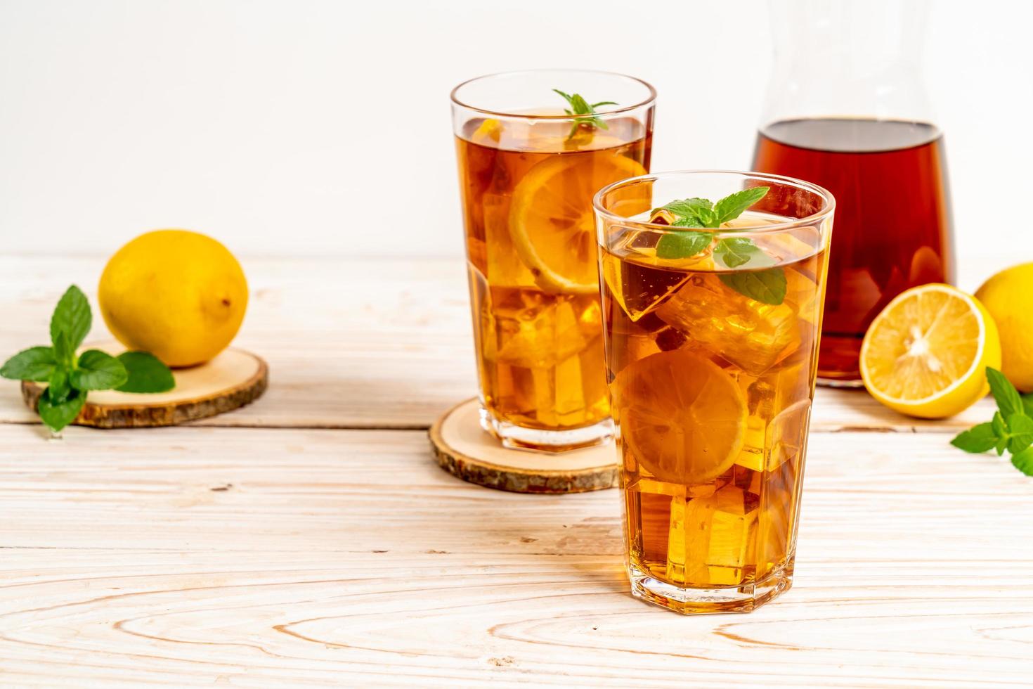 Glass of ice lemon tea with mint photo