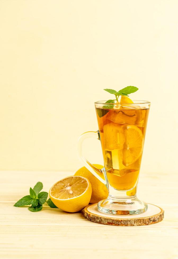 Glass of ice lemon tea with mint photo