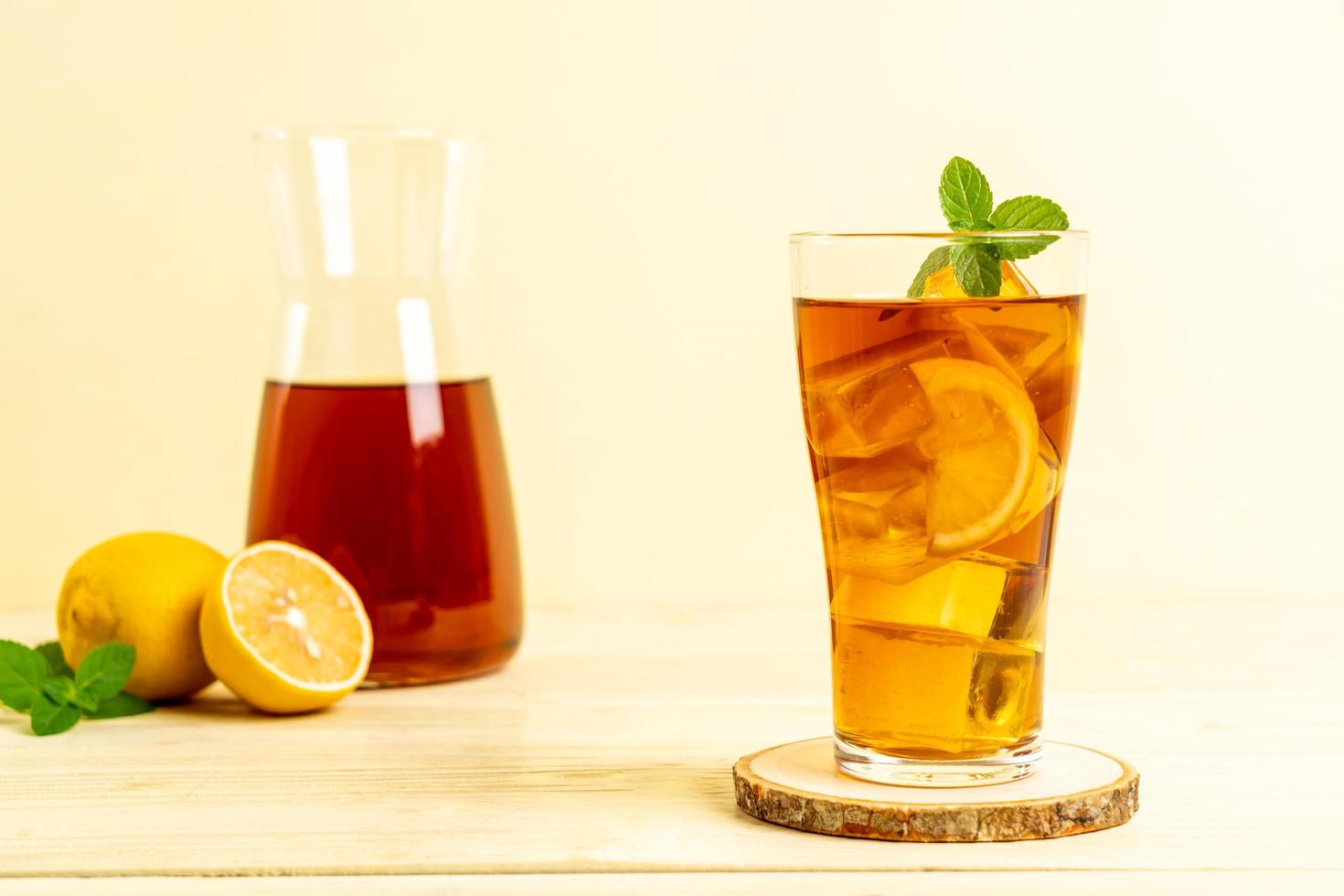 Glass of ice lemon tea with mint photo