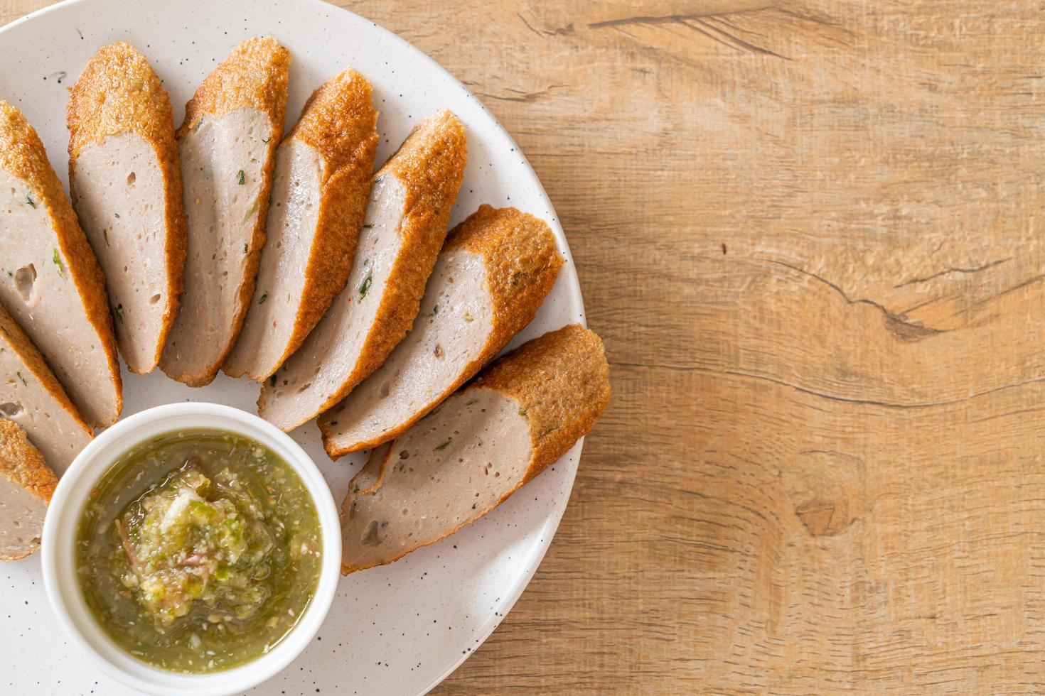 Fried Chinese fish cake or fish ball line sliced with spicy seafood