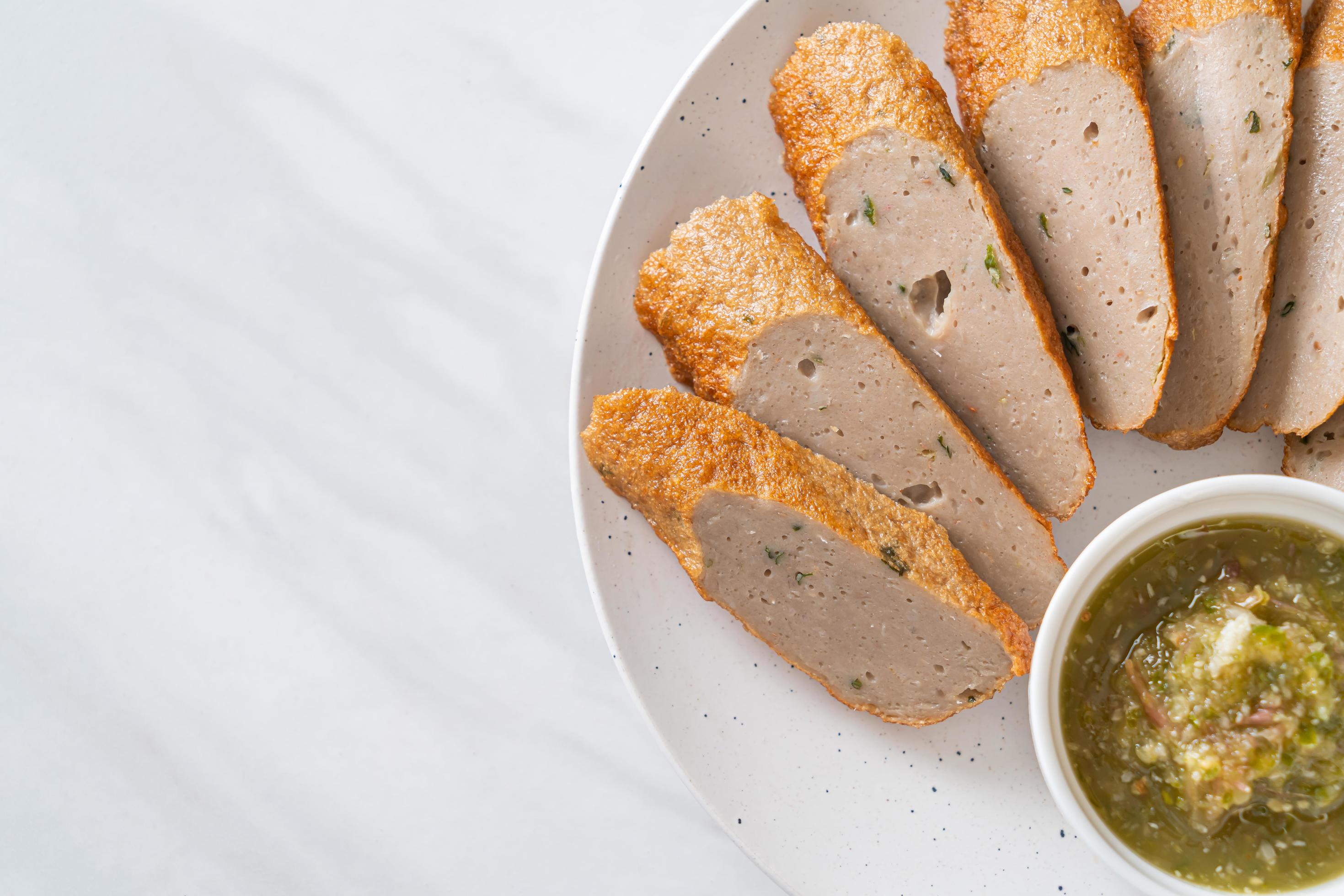 Fried Chinese fish cake or fish ball line sliced with spicy seafood