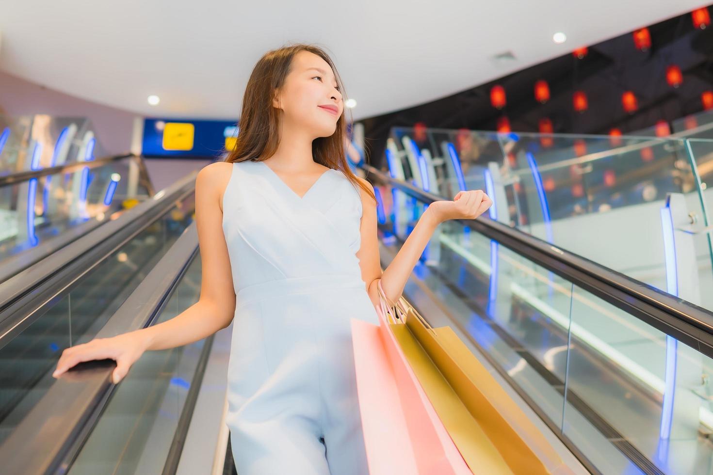 Portrait beautiful young asian woman happy and smile with shopping bag from department store photo