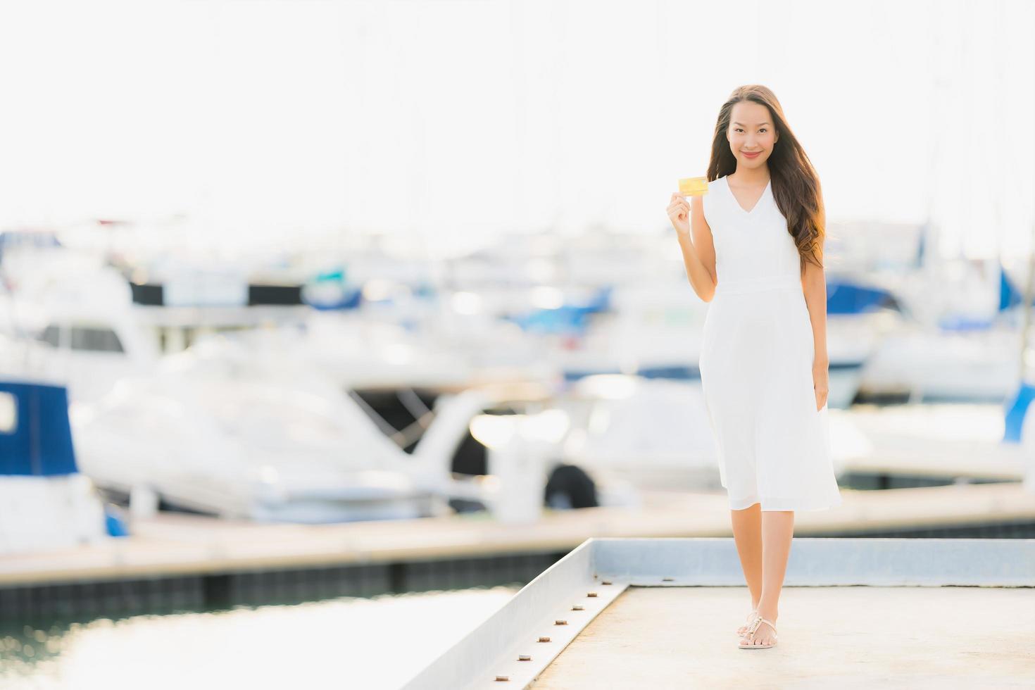 Portrait beautiful young asian woman leisure smile happy relax around yacht port photo