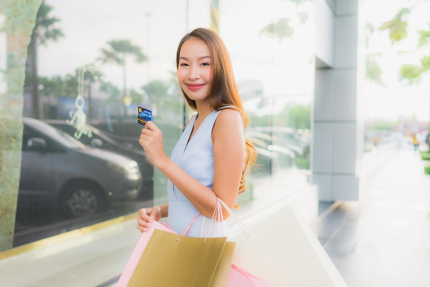 Portrait beautiful young asian woman happy and smile with shopping bag from department store photo