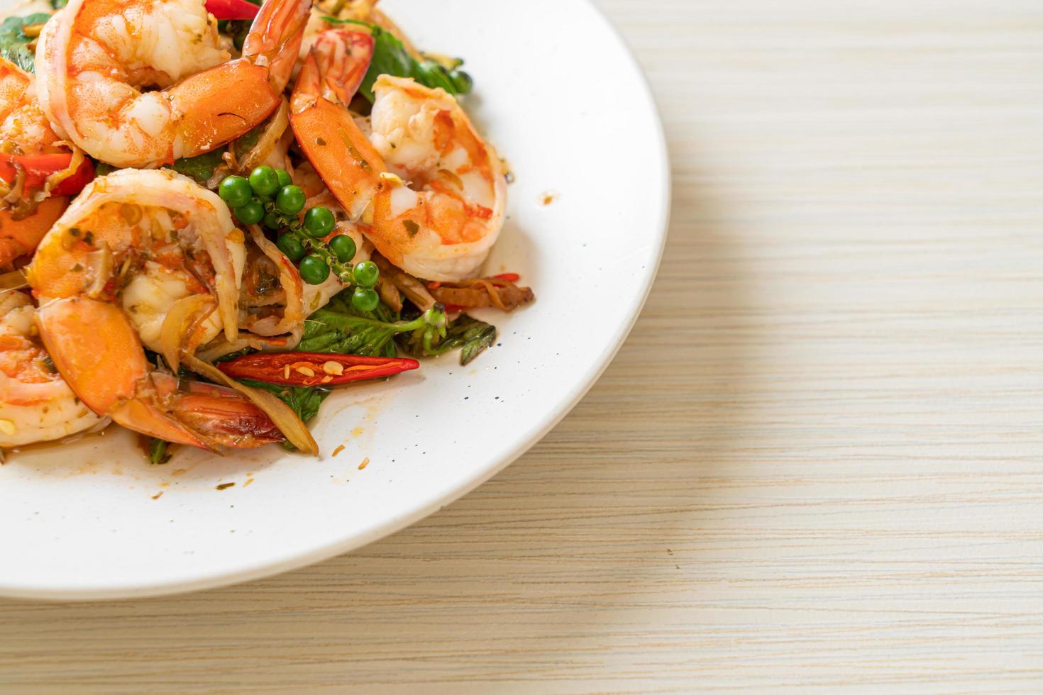 Stir-fried holy basil with shrimps and herb - Asian food style photo