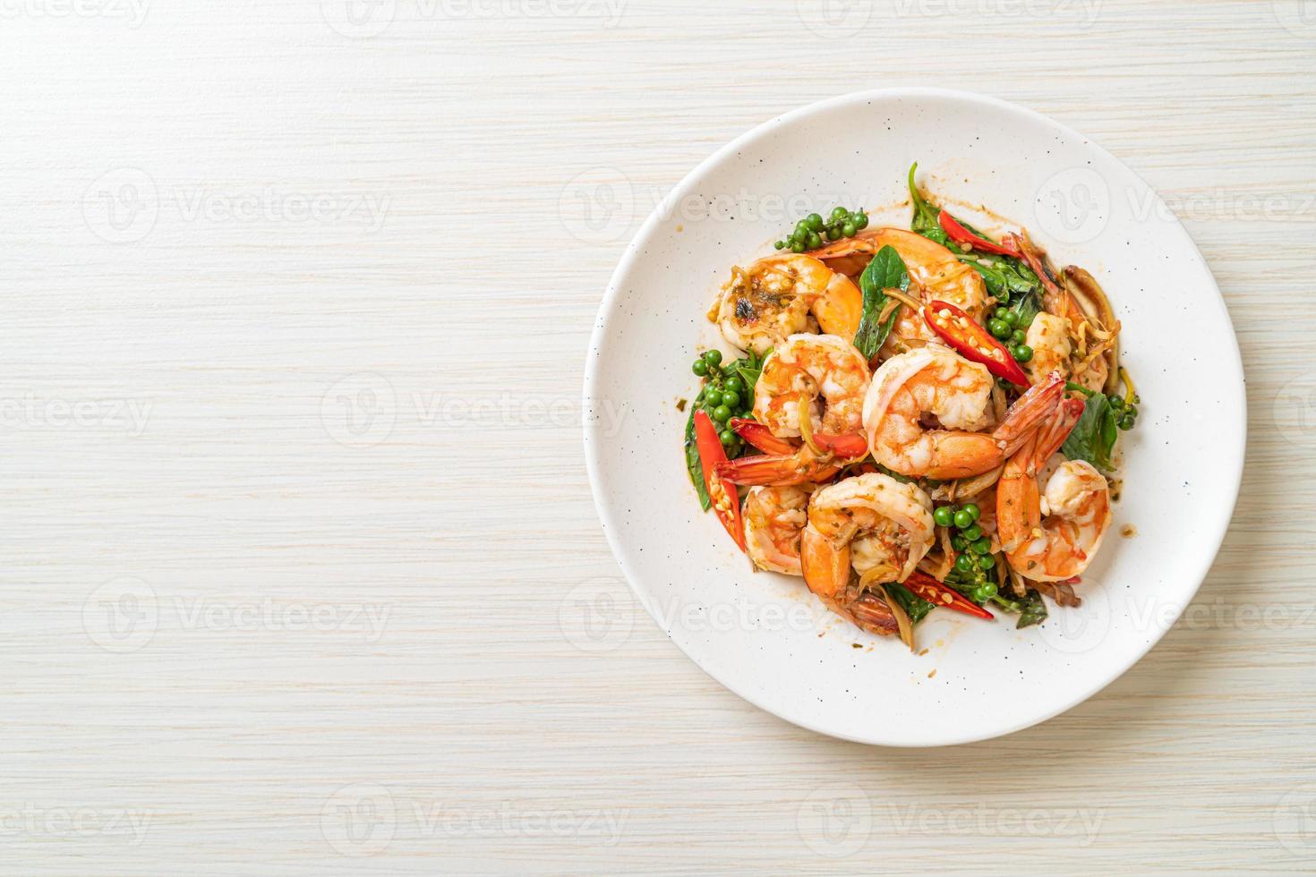 Stir-fried holy basil with shrimps and herb - Asian food style photo