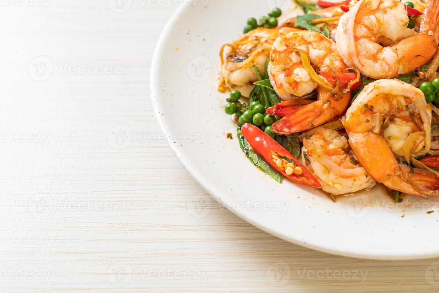 Stir-fried holy basil with shrimps and herb - Asian food style photo