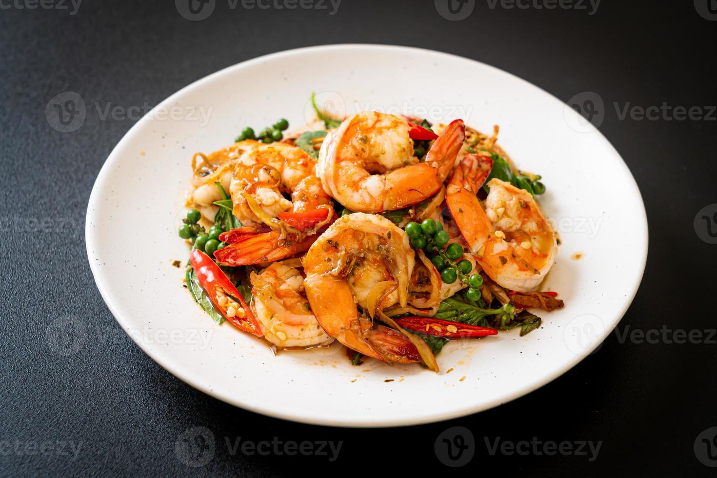 Stir-fried holy basil with shrimps and herb - Asian food style photo