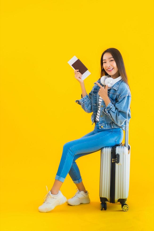 Portrait beautiful young asian woman travel and leisure with luggage bag and passport photo