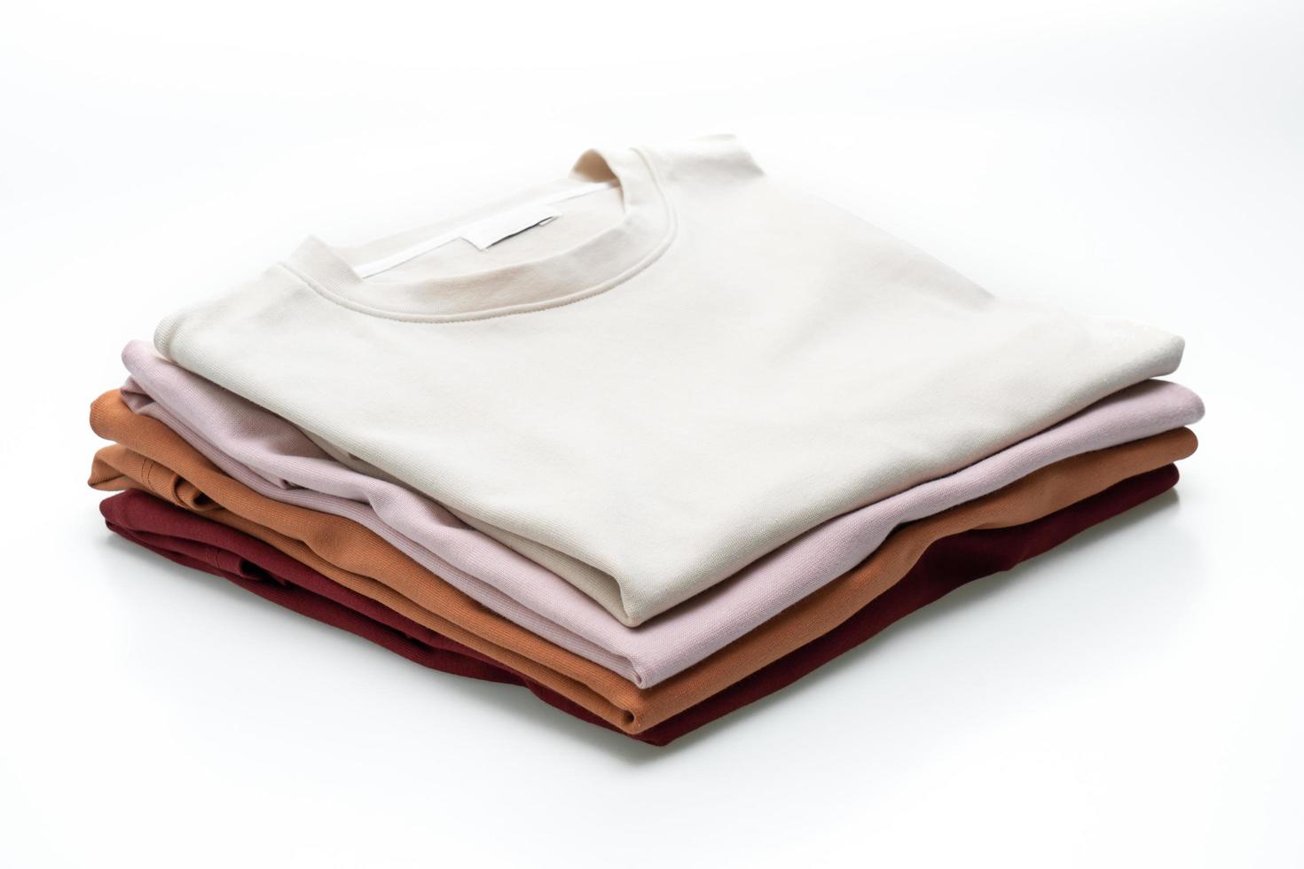 Folded t-shirts isolated on white background photo