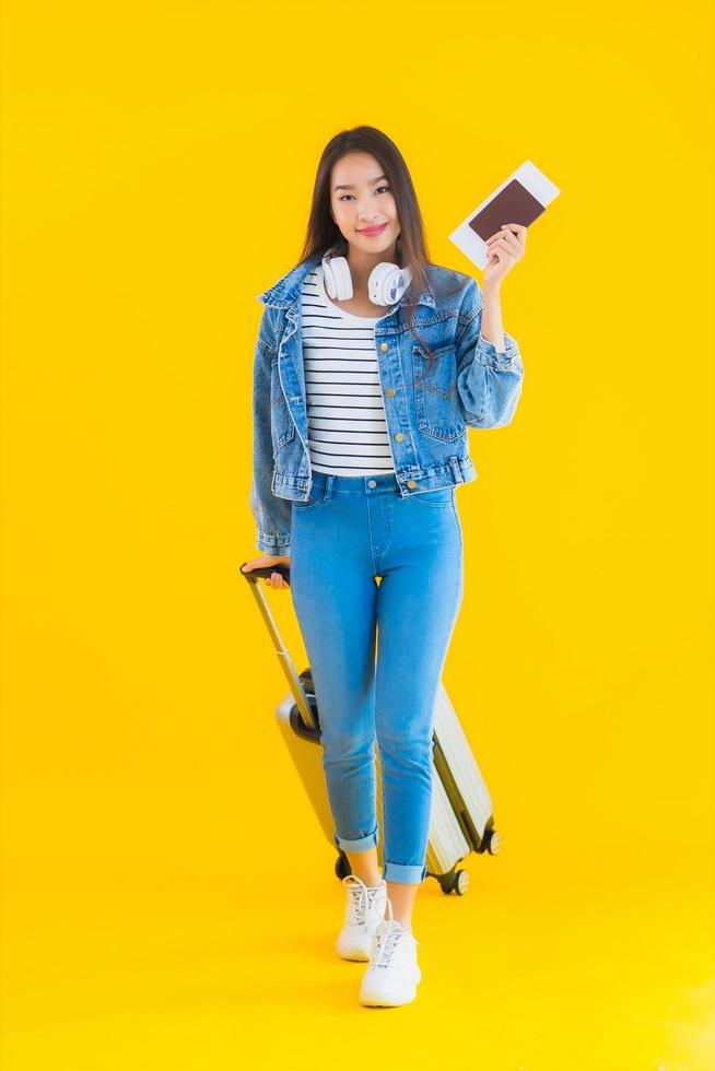 Portrait beautiful young asian woman travel and leisure with luggage bag and passport photo