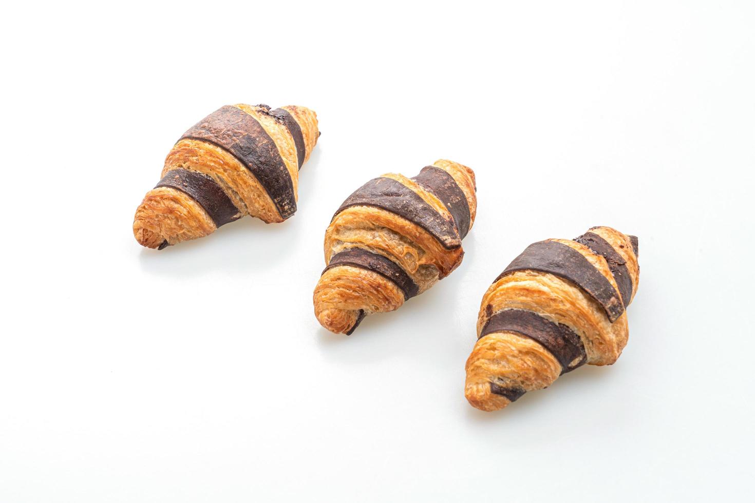 Fresh croissant with chocolate isolated on white background photo