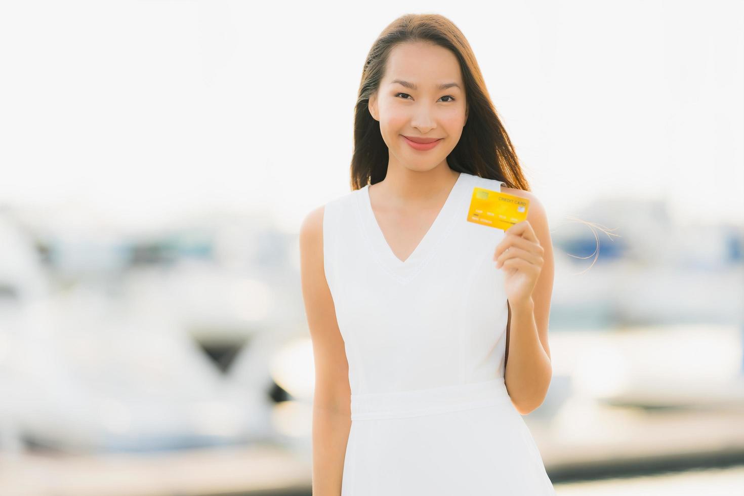 Portrait beautiful young asian woman leisure smile happy relax around yacht port photo