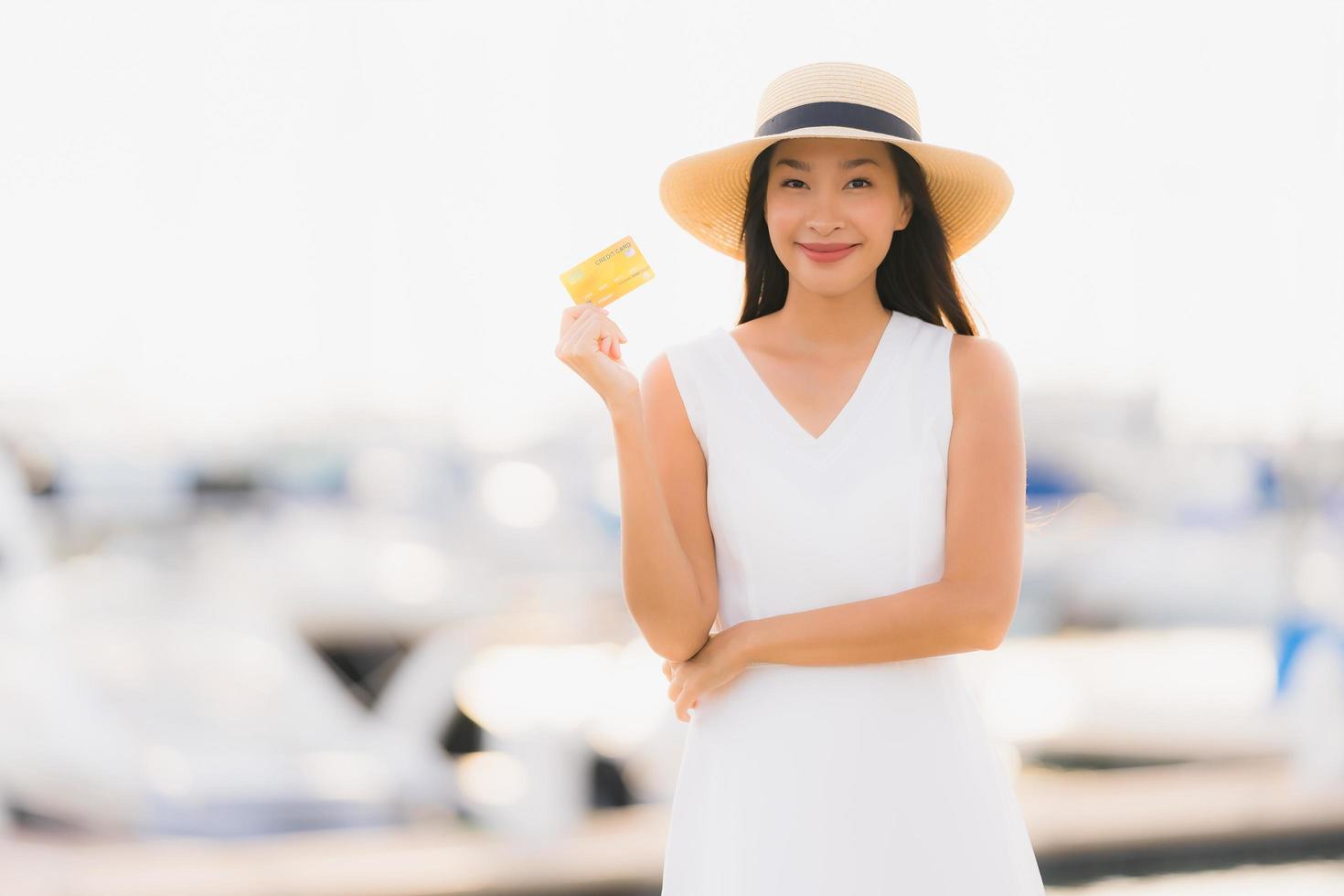 Portrait beautiful young asian woman leisure smile happy relax around yacht port photo