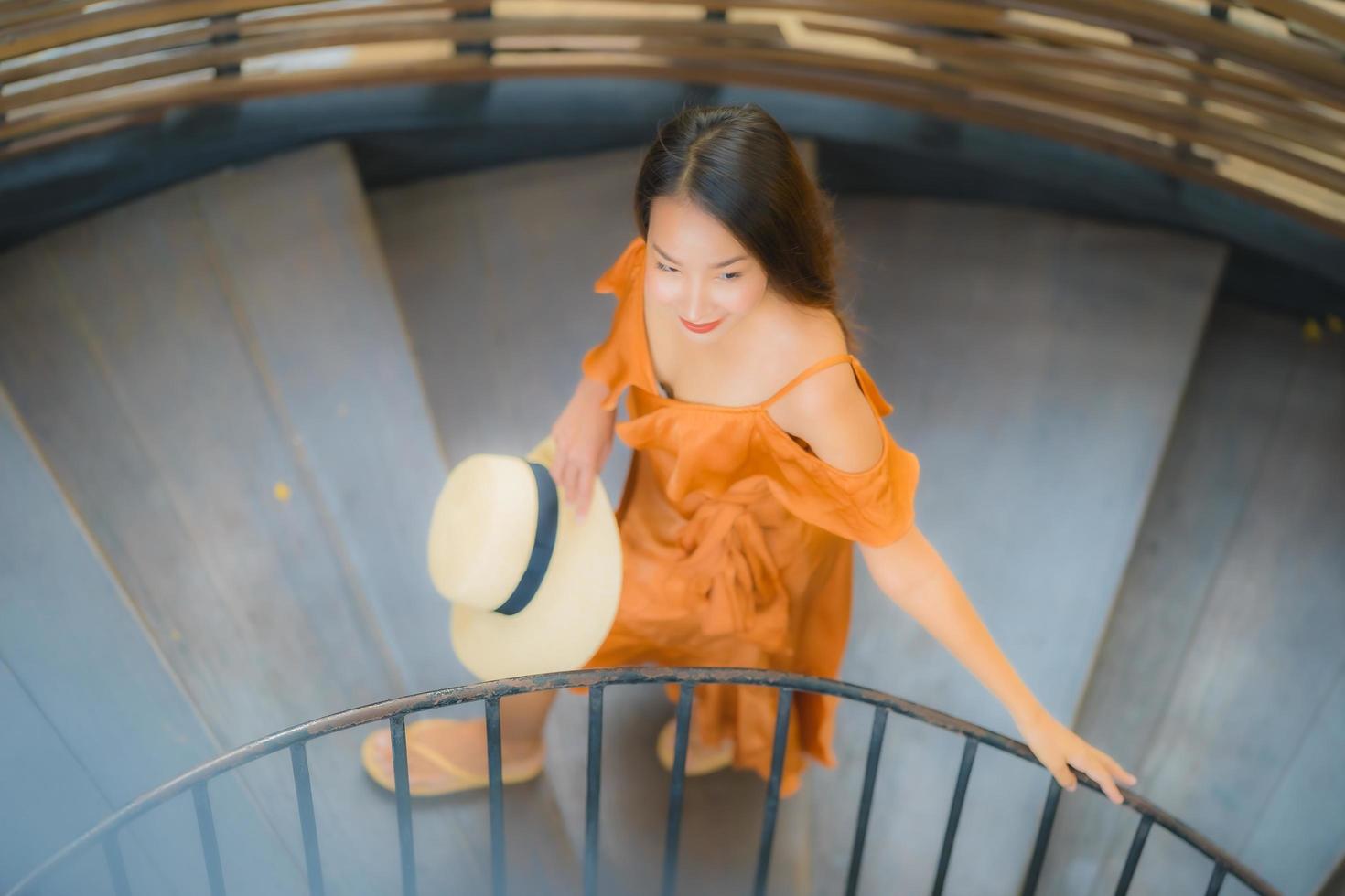 Portrait beautiful young asian woman walk on circle stair photo