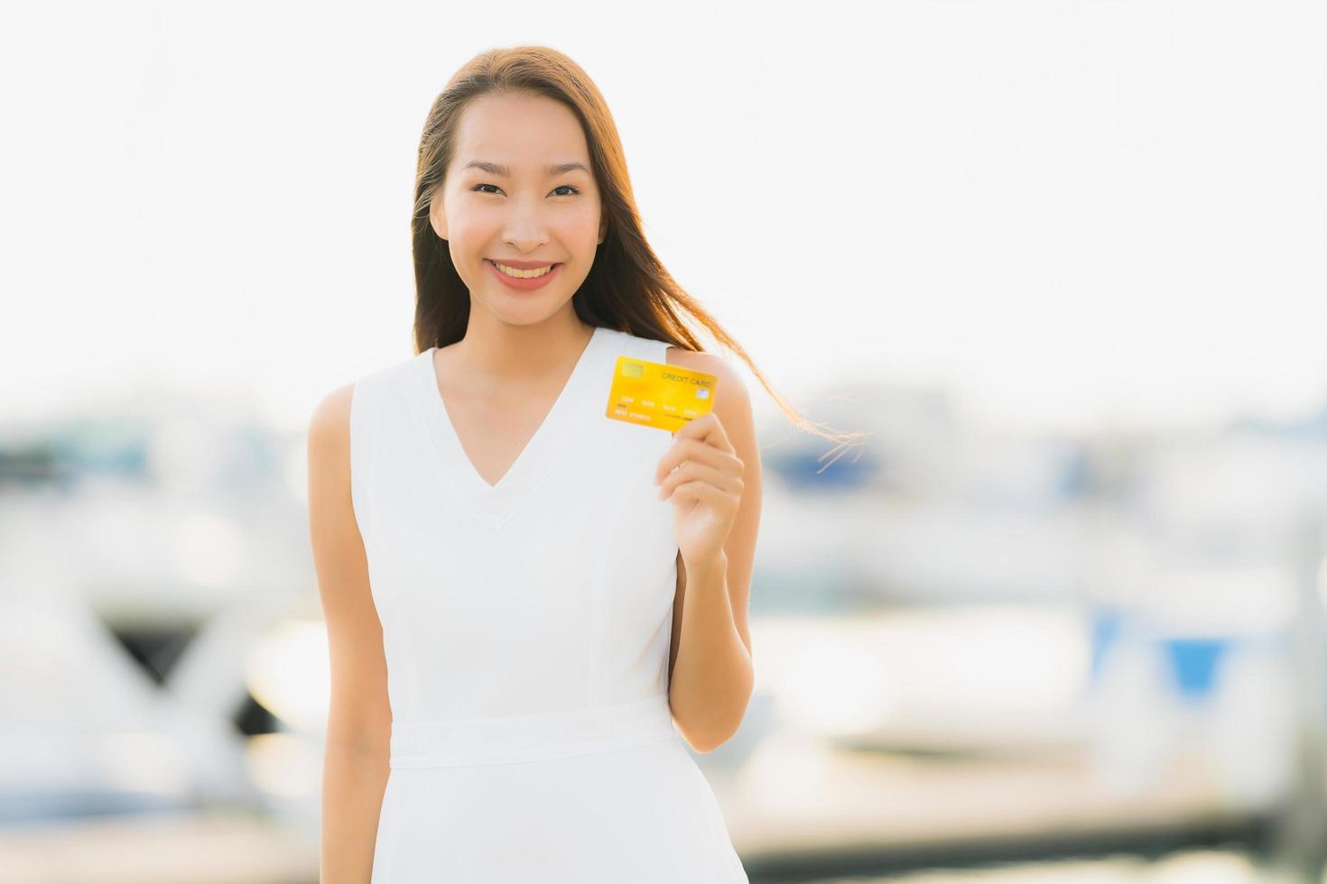 Portrait beautiful young asian woman leisure smile happy relax around yacht port photo