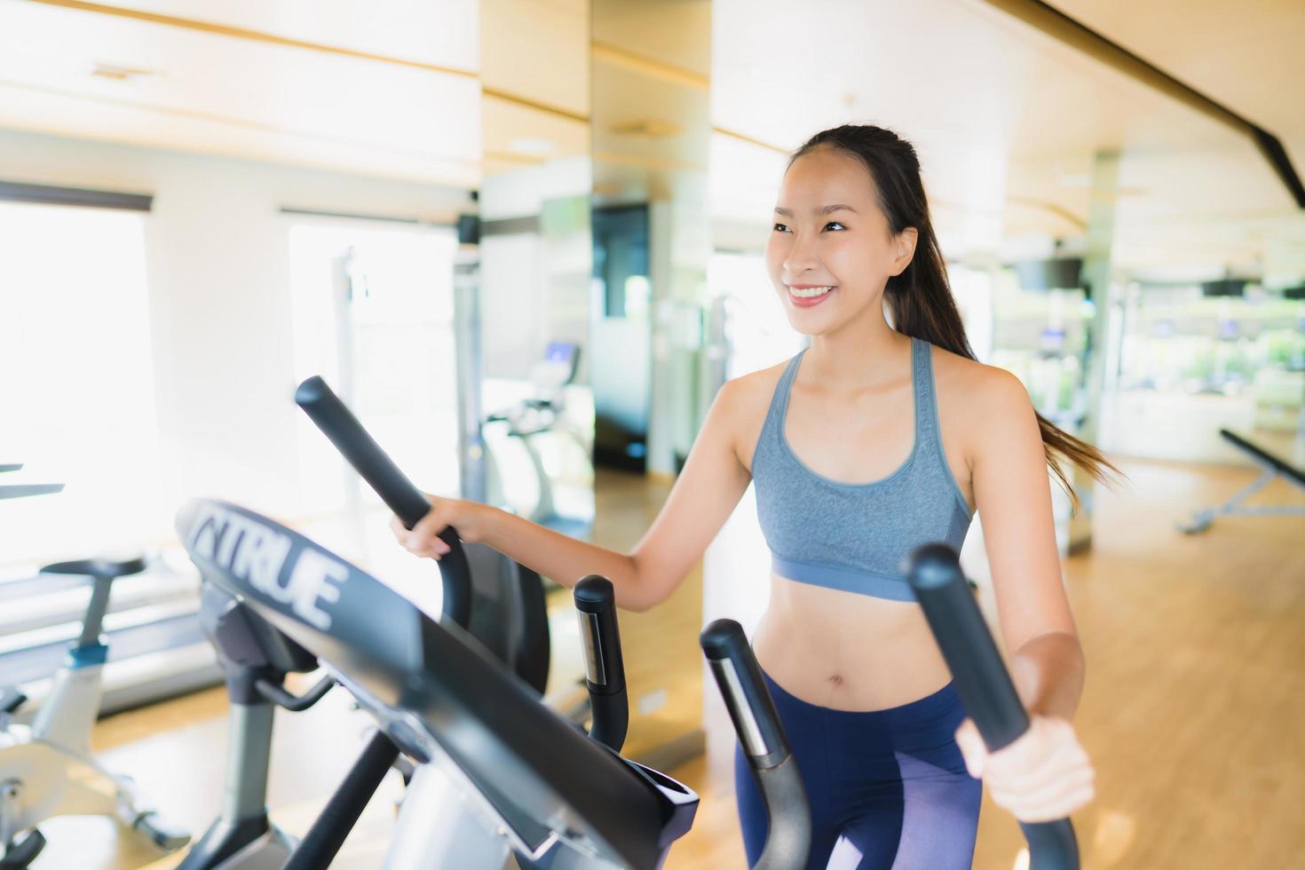 Portrait asian woman exercising and work out in gym photo