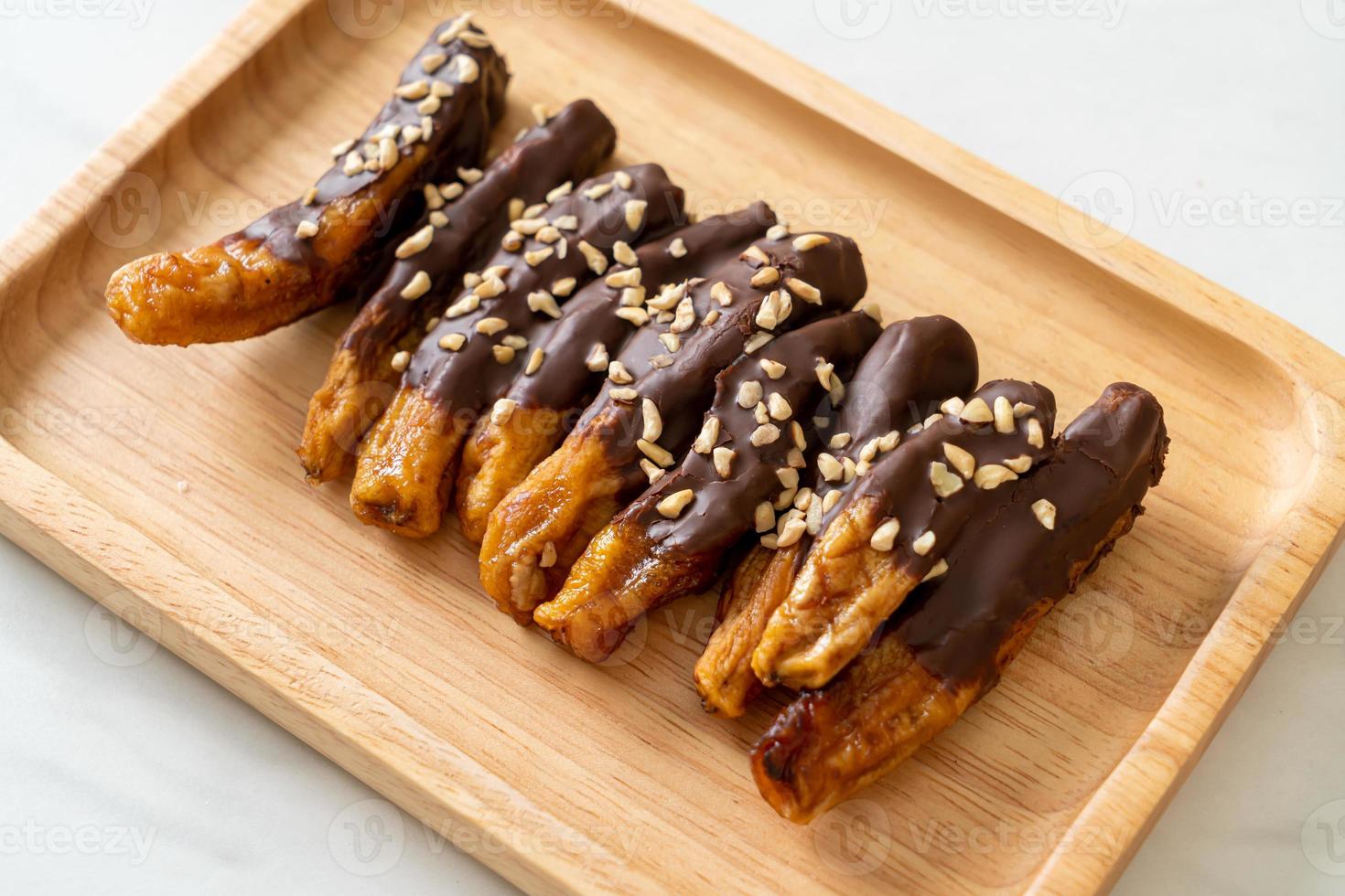 Solar sun-dried banana chocolate coating or banana dipped chocolate photo