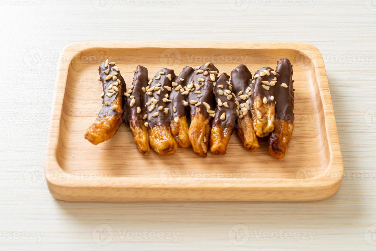 Solar sun-dried banana chocolate coating or banana dipped chocolate photo