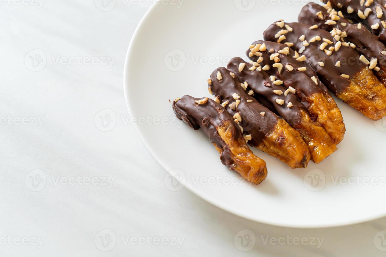 Solar sun-dried banana chocolate coating or banana dipped chocolate photo