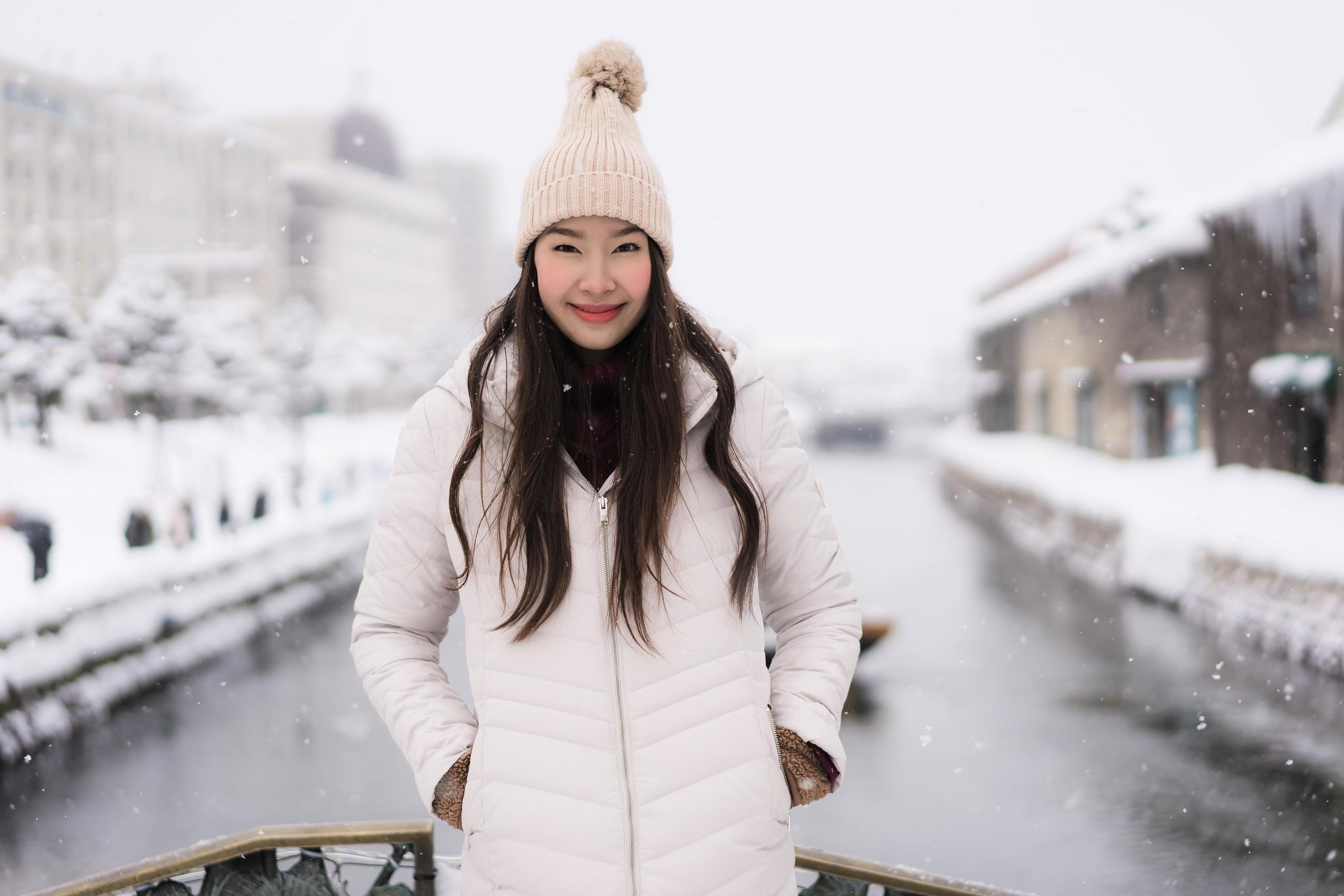 Beautiful young asian woman smile and happy with travel trip in Otaru ...