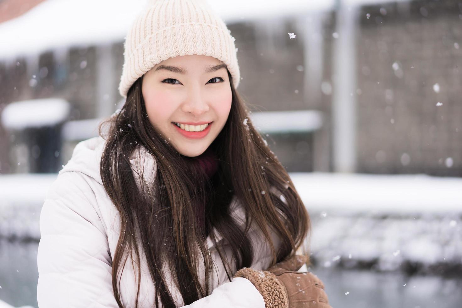 Beautiful young asian woman smile and happy with travel trip in Otaru canal Hokkaido Japan photo