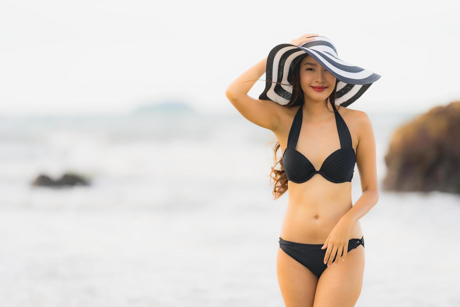 Portrait beautiful young asian woman wear bikini on the beach sea ocean photo
