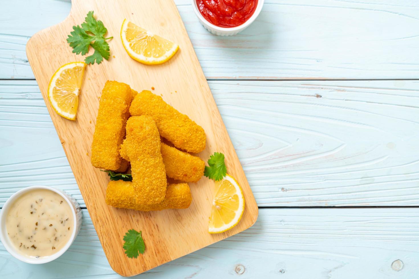 Fried fish finger sticks or french fries fish with sauce photo