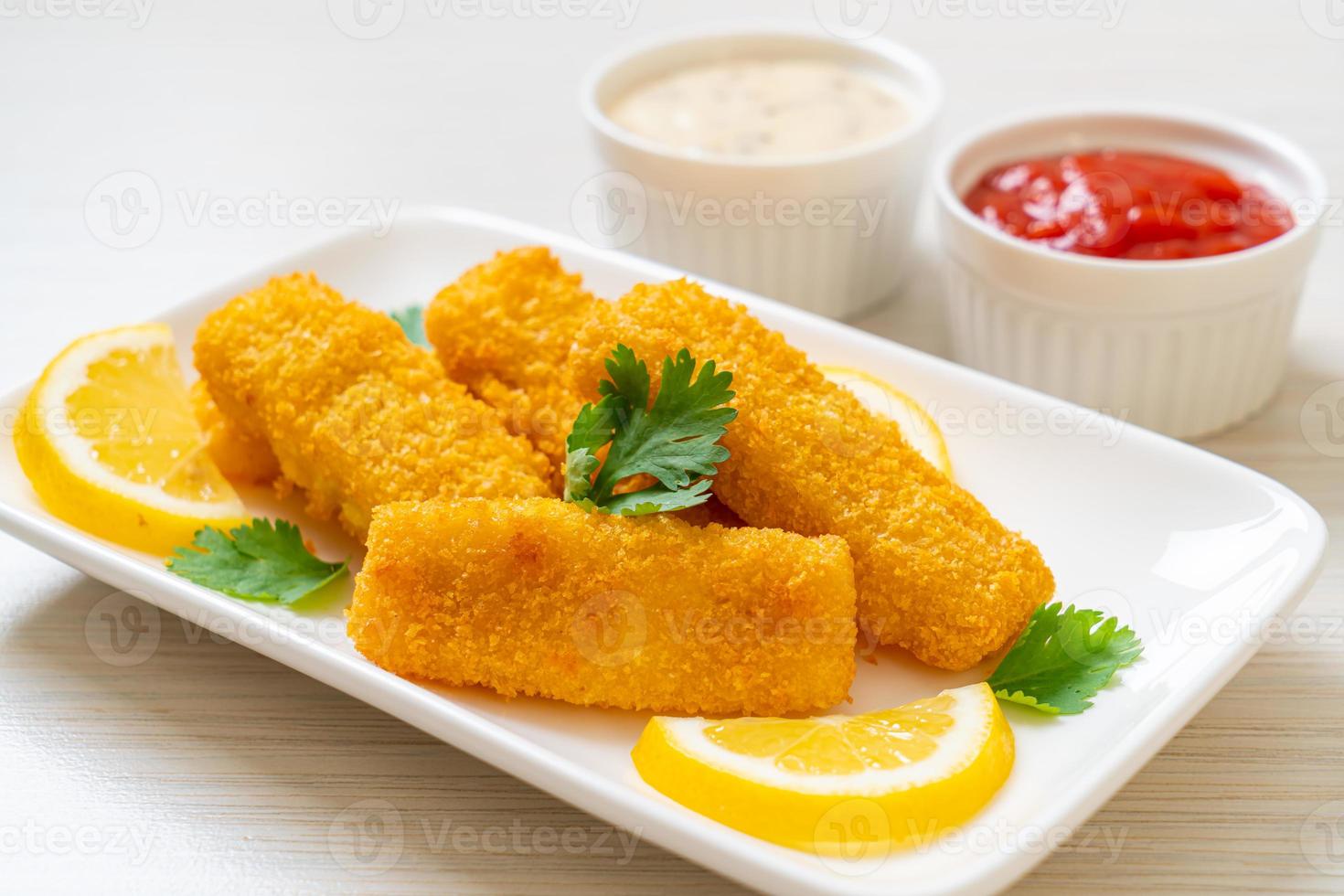 Fried fish finger sticks or french fries fish with sauce photo