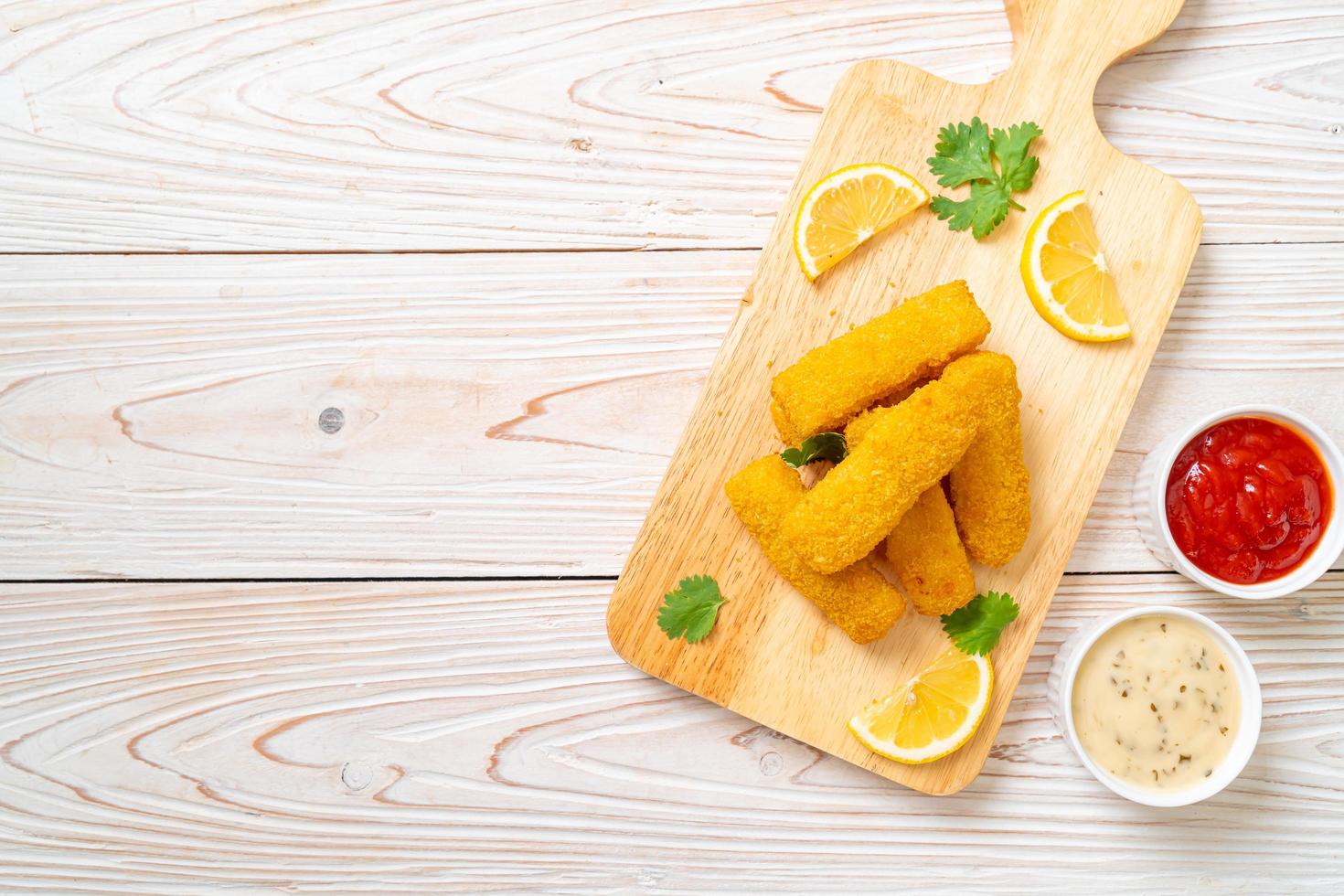 Fried fish finger sticks or french fries fish with sauce photo